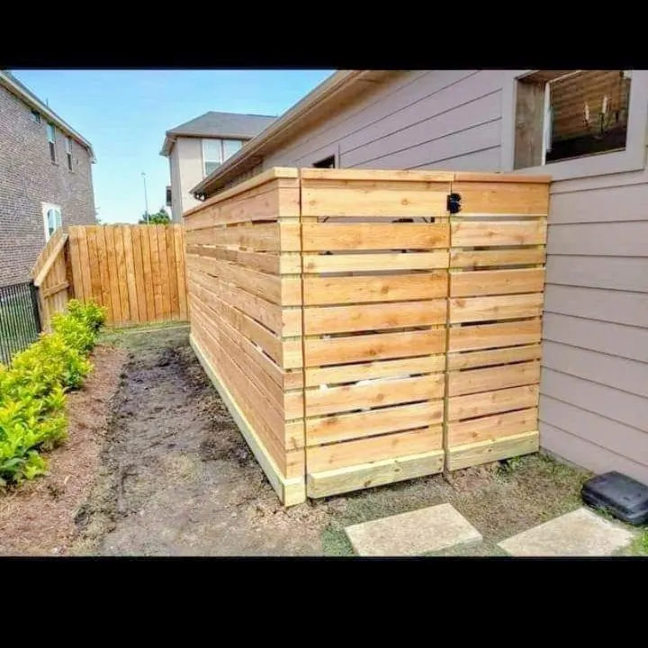Horizontal wood screen enclosing pool equipment in Sugar Land
