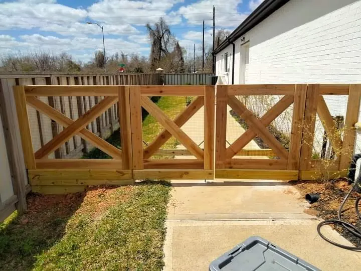 Wood double gate with an X-brace design in Sugar Land