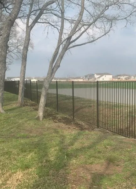 Black metal fence along an open field in Richmond
